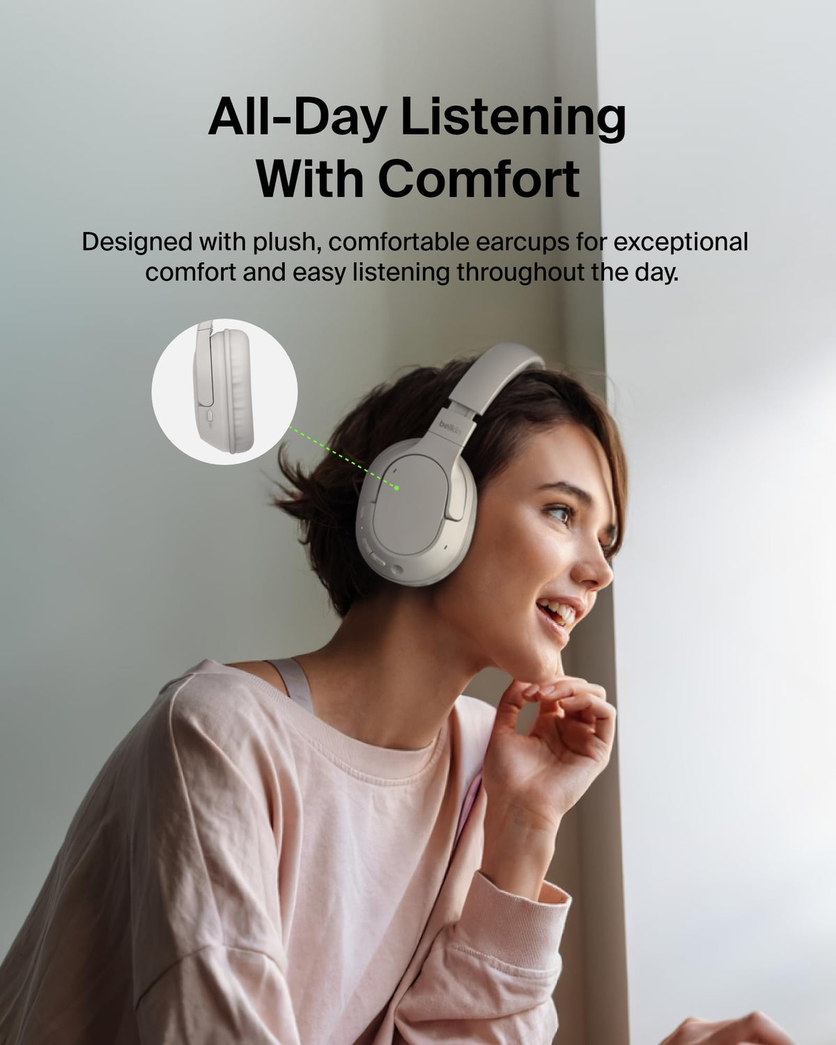 Traveler wearing Belkin headphones on plane demonstrating long battery advantage