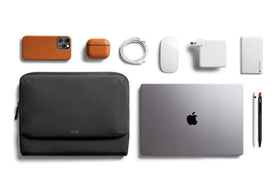 Bellroy Laptop Caddy front pocket holds charging brick or headphones for travel.