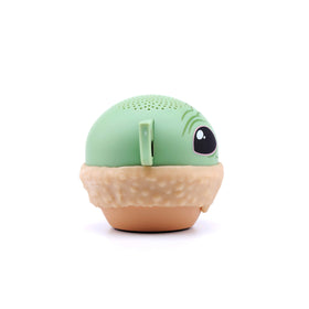 Bitty Boomers Grogu clipped to a backpack showing portability and hands-free listening benefit