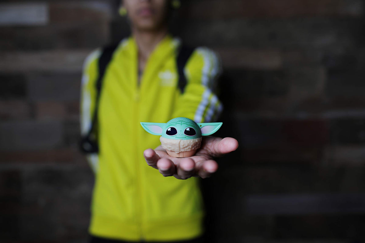Bitty Boomers Grogu in hand to show scale and pocket-friendly portability benefit