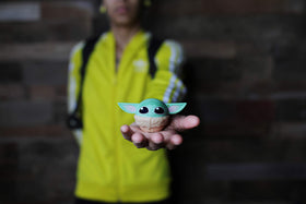 Bitty Boomers Grogu in hand to show scale and pocket-friendly portability benefit