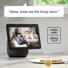 Blink Mini mounted on wall with household objects for size comparison and easy installation