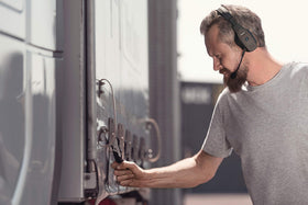 BlueParrott B550-XT worn-on-ear demonstrates lightweight comfort for long calls.