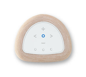 White tan Bluesound Pulse Flex in a modern kitchen setup.