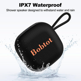 Bobtot Bluetooth speaker with lanyard attached for easy bag or bike mounting.