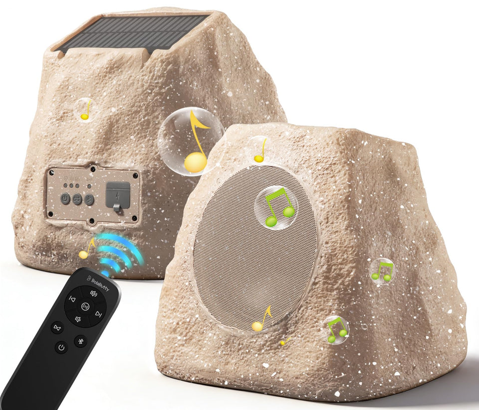 BolaButty 2-pack outdoor rock speakers set up for yard parties with immersive audio.