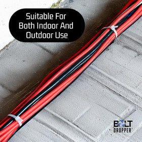 Bolt Dropper zip tie outdoors shows weatherproof design for durable outdoor projects.