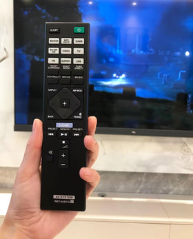 BOMAZ remote in use on a couch arm showing comfortable reach and control