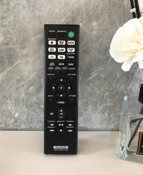 BOMAZ remote in hand showing compact size for comfortable handling