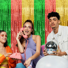 BOMSI tinsel curtain in photo booth creating a vivid party backdrop