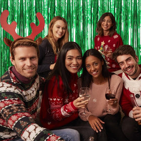 BOMSI green foil fringe backdrop adds holiday shine to celebrations
