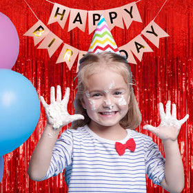 BOMSI party backdrop with red foil streamers for event decor