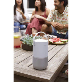 Bose Portable Smart Speaker in silver, in-home setup, versatile multi-room audio throughout the house