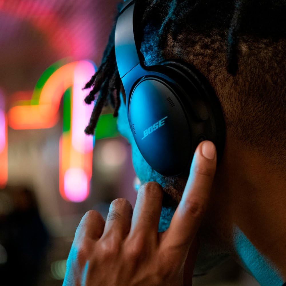 Bose QuietComfort 45 worn, demonstrates snug over-ear fit and comfort.