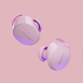 Bose QuietComfort Earbuds Petal Pink earbuds outside the case ready to listen.