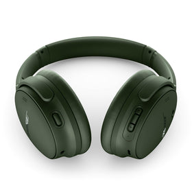 Bose QuietComfort Cypress Green worn by a model, demonstrating secure over-ear fit.