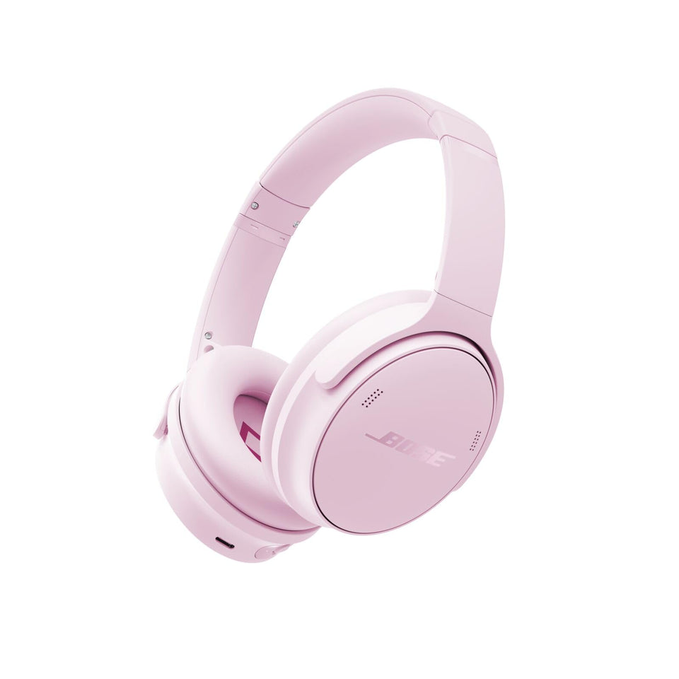 Bose QuietComfort headphones in Petal Pink, front view highlighting design and noise cancellation.