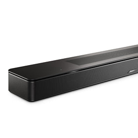 Soundbar placed beside a TV in a home entertainment setup for theater-like sound