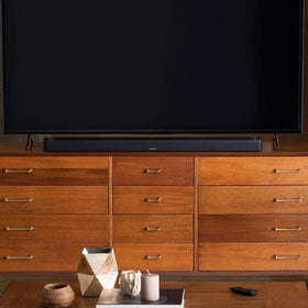Bose Smart Soundbar 900 top-angle view showcases sleek design for modern living rooms.