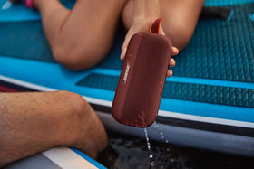 Bose SoundLink Flex Carmine Red - action shot during outdoor adventure.