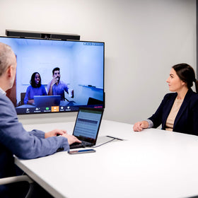 Bose Videobar VB1 in use in a compact conference room with natural sound and autoframing