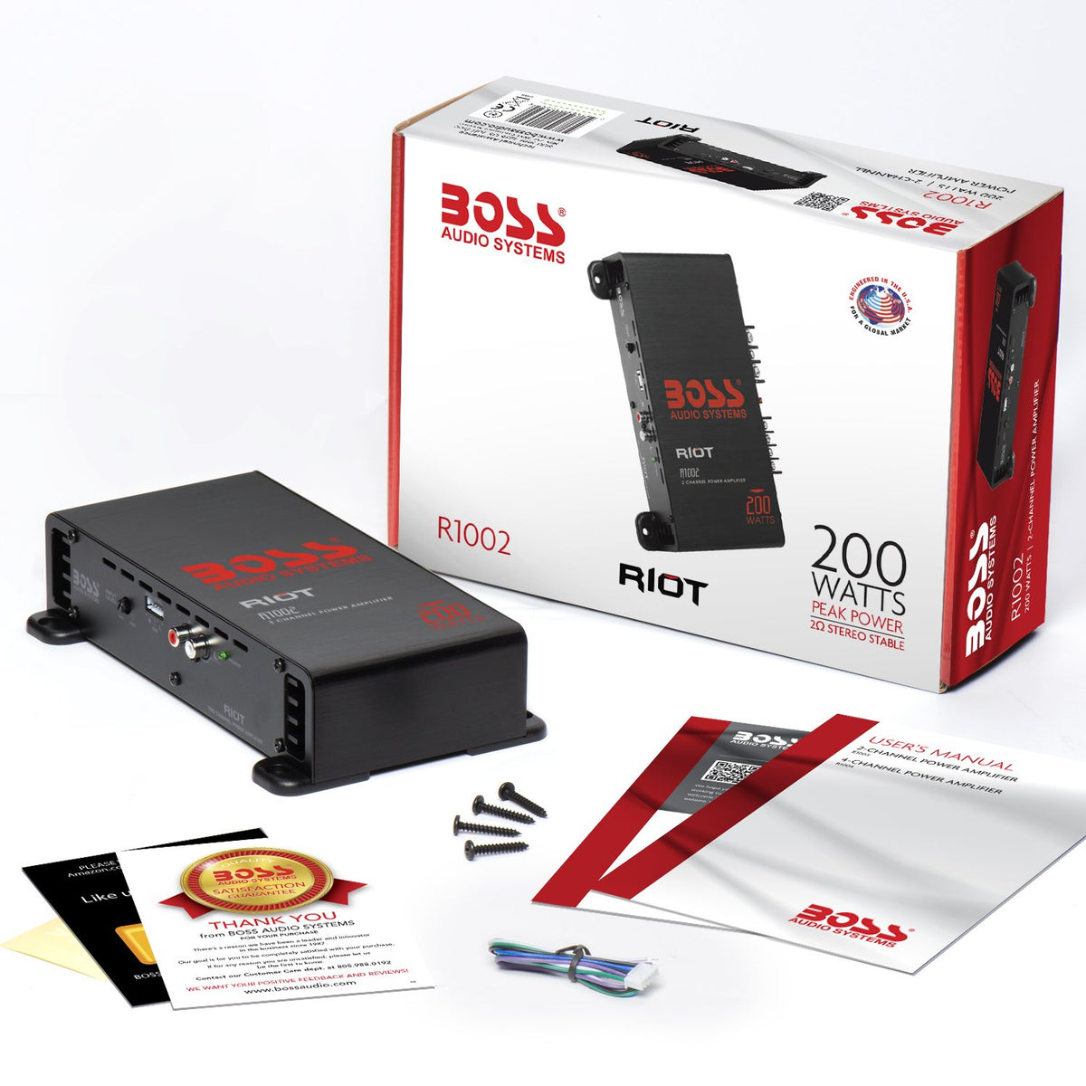 BOSS Audio Systems R1002 size comparison beside a smartphone to show compact dimensions