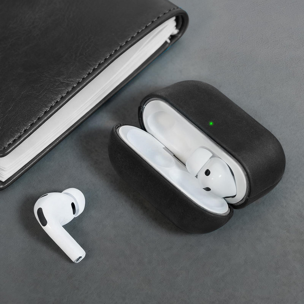 Bouixel next to AirPods case for scale showing compact protective profile