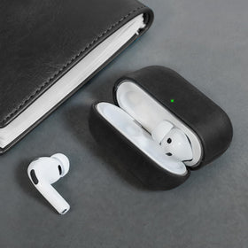 Bouixel next to AirPods case for scale showing compact protective profile