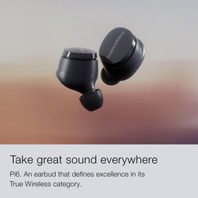 Bowers & Wilkins Pi6 forest green earbuds in ear with secure fit for workouts.