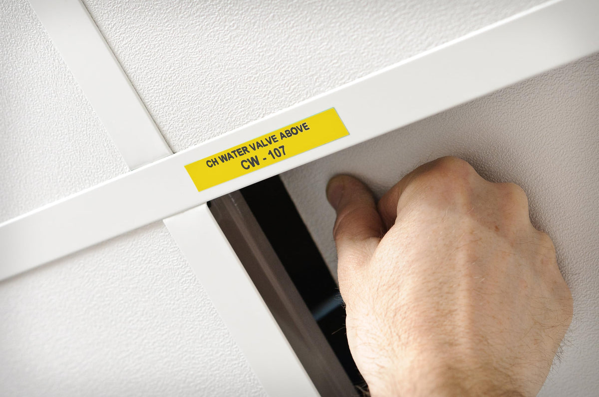 Brady all-weather labels resist UV and chemicals on industrial equipment.