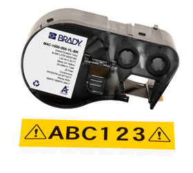Brady Authentic all-weather labels on pipes for durable outdoor labeling.
