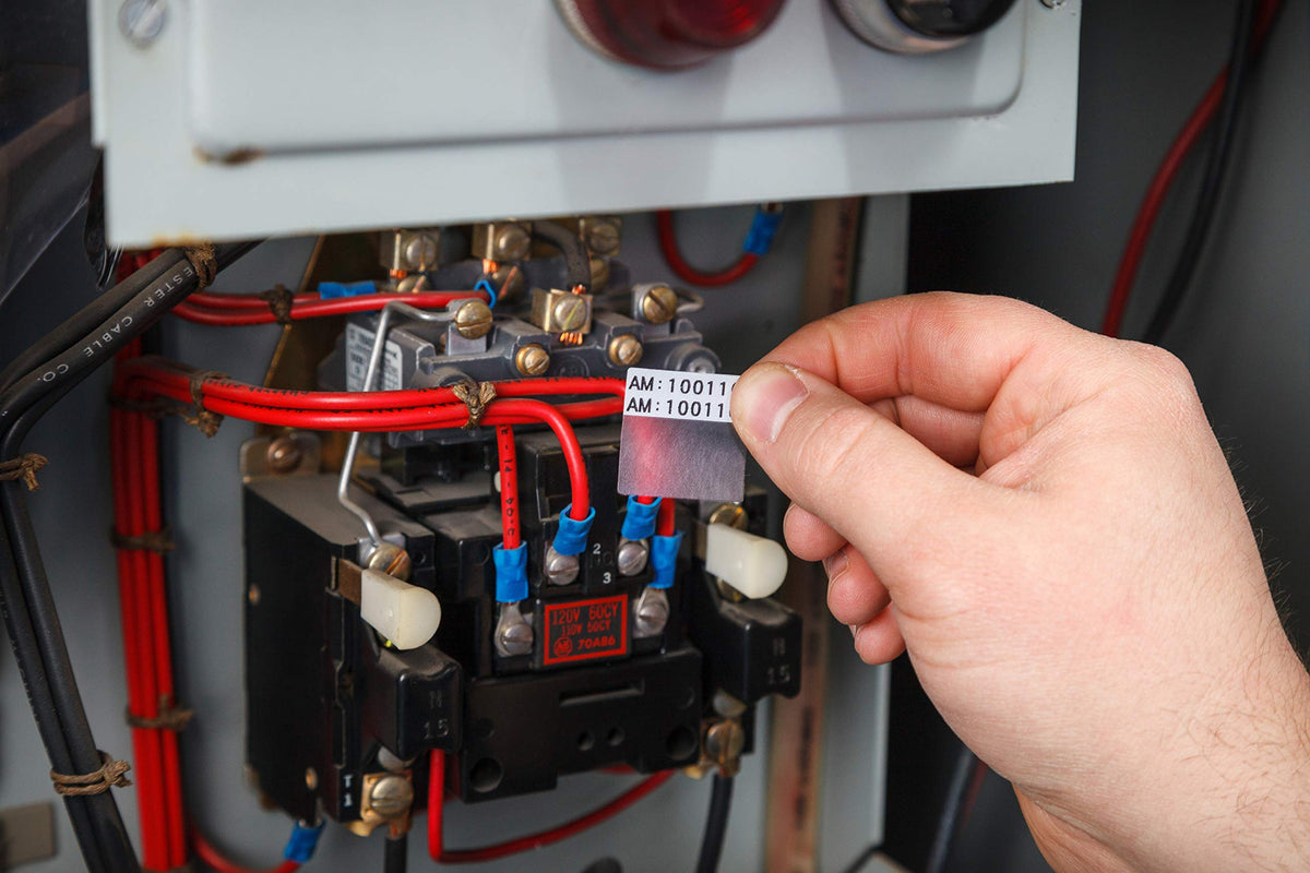 Brady self-laminating label wrapped on cable showing durable adhesion and protected text