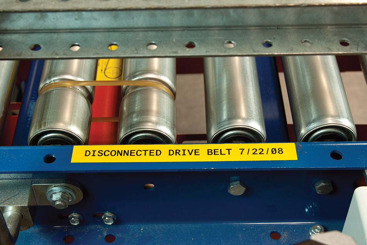 Brady label adhered to painted cinder block showing strong adhesion and legibility