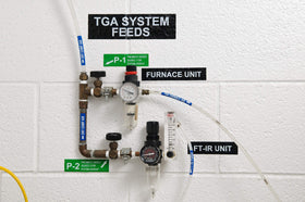Brady white-on-black label on equipment panel improving identification