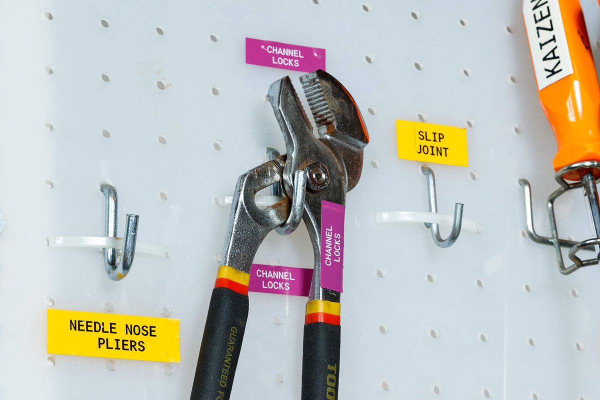 Brady white-on-purple label adhered to metal equipment illustrating long-lasting visibility