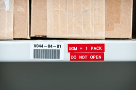 Brady label on painted cinder block, illustrating adhesion to textured surfaces