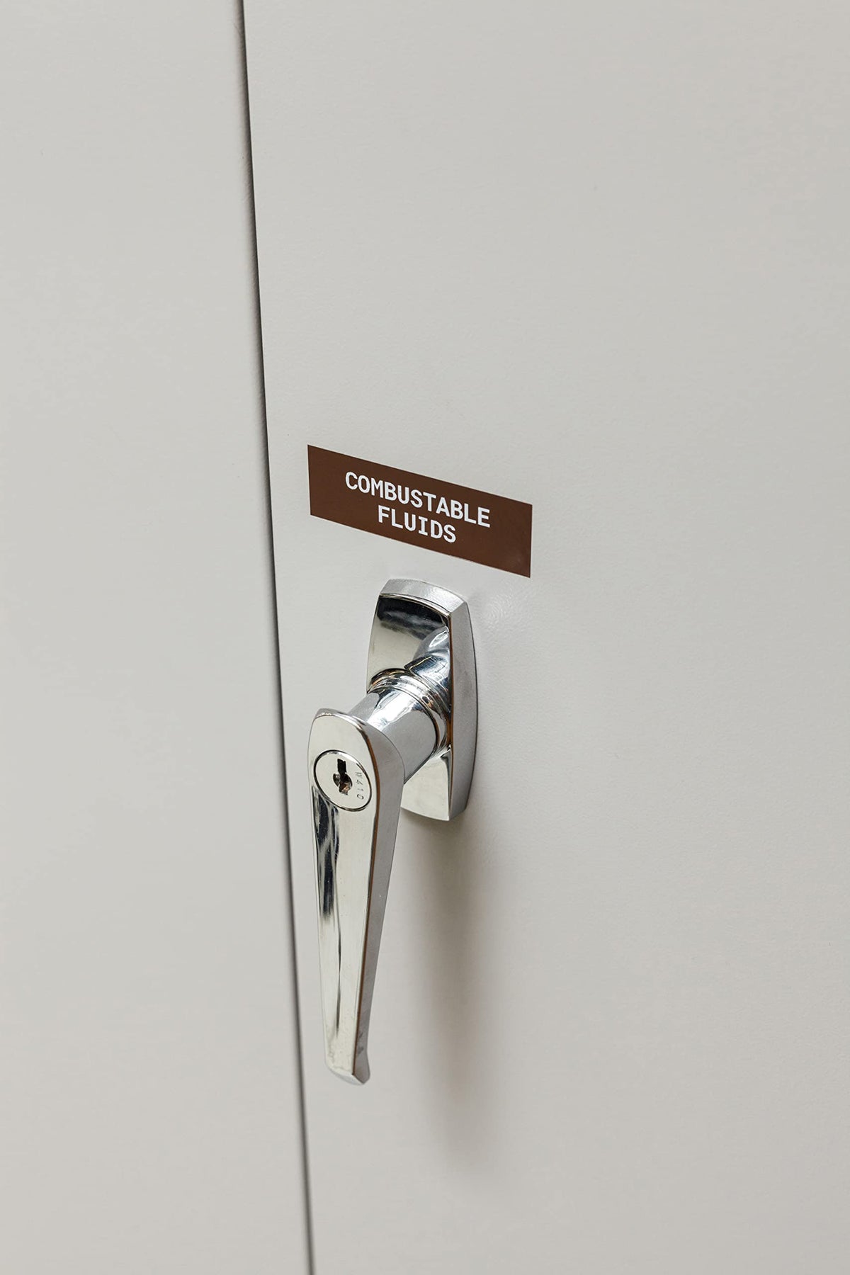 Brady vinyl label applied to curved pipe showcasing strong adhesion benefit