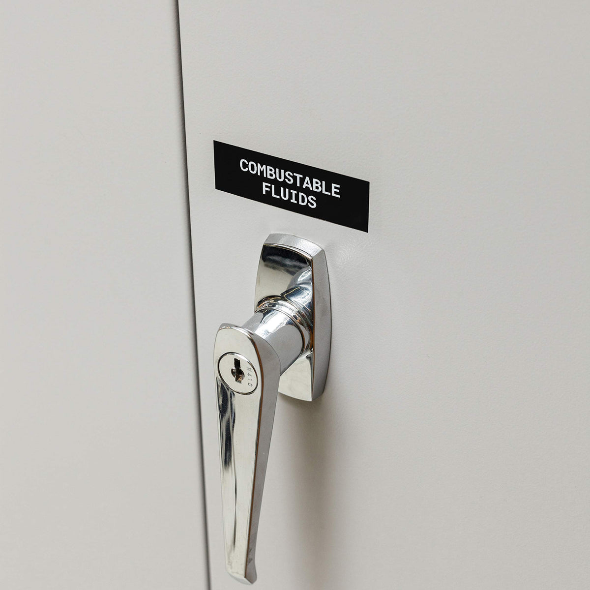 Brady printed white-on-black label applied to industrial equipment for clear ID