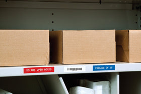 Label roll beside ruler showing .75 inch width and 21 foot length clarity