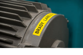 Brady tape width and 21-foot roll beside ruler illustrating size and length