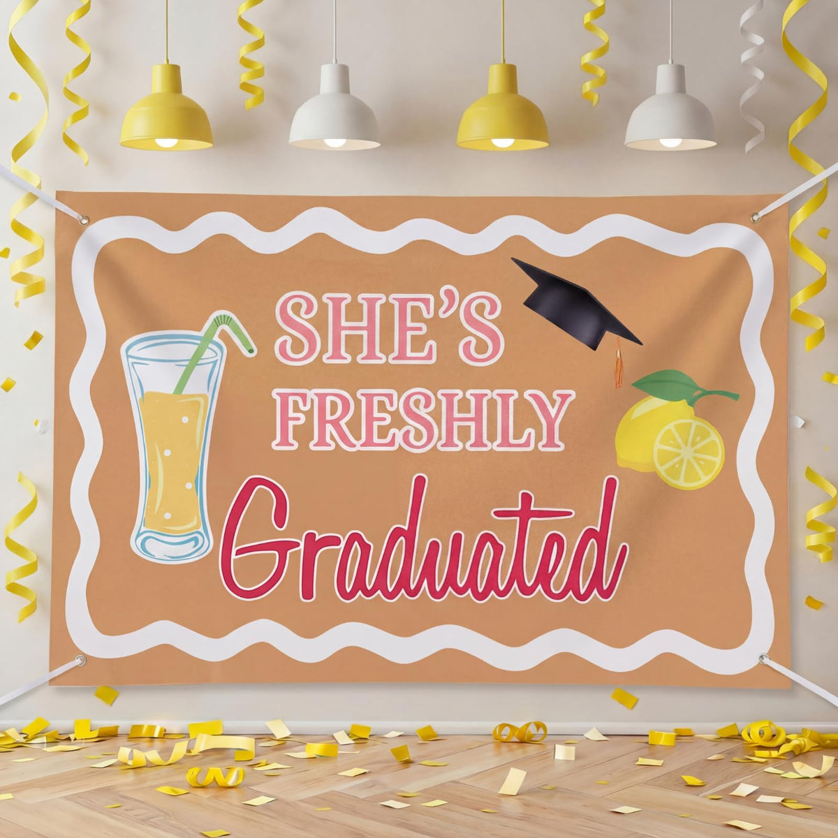 Breling graduation backdrop with lemons and diplomas, perfect for memorable graduation photos.