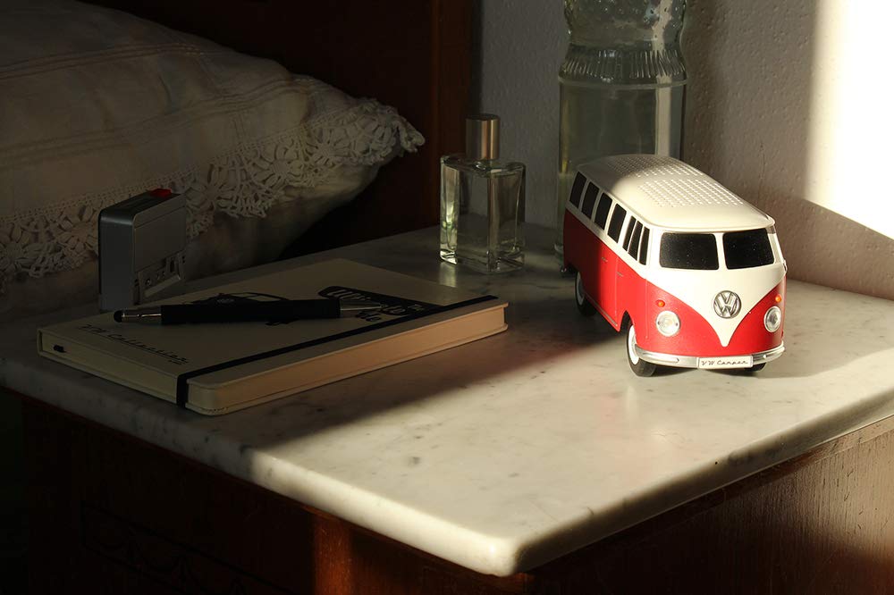 BRISA T1 Bus held in hand showing compact 1:20 scale and travel-friendly size