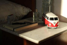 BRISA T1 Bus held in hand showing compact 1:20 scale and travel-friendly size