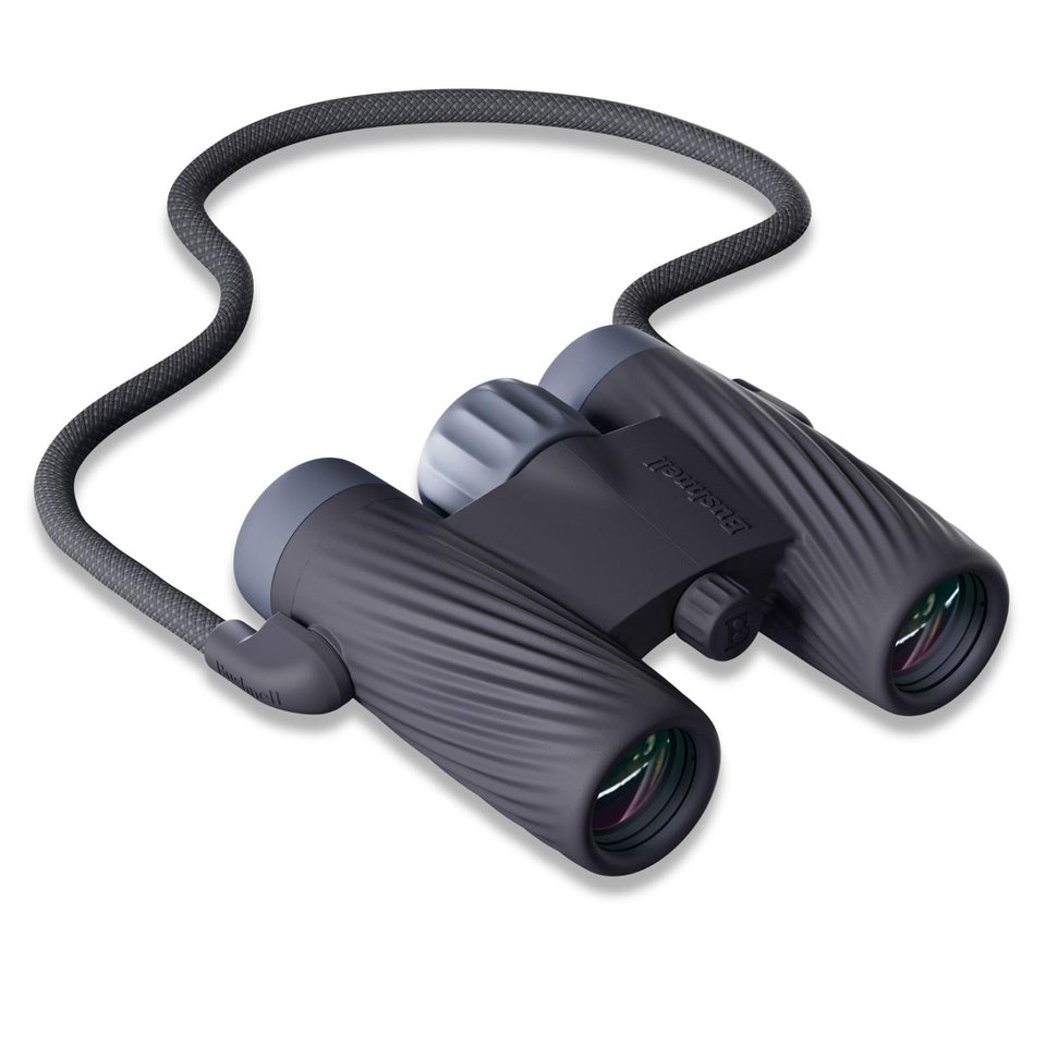 Bushnell A1 8x25 compact binoculars in hand for travel and everyday adventures