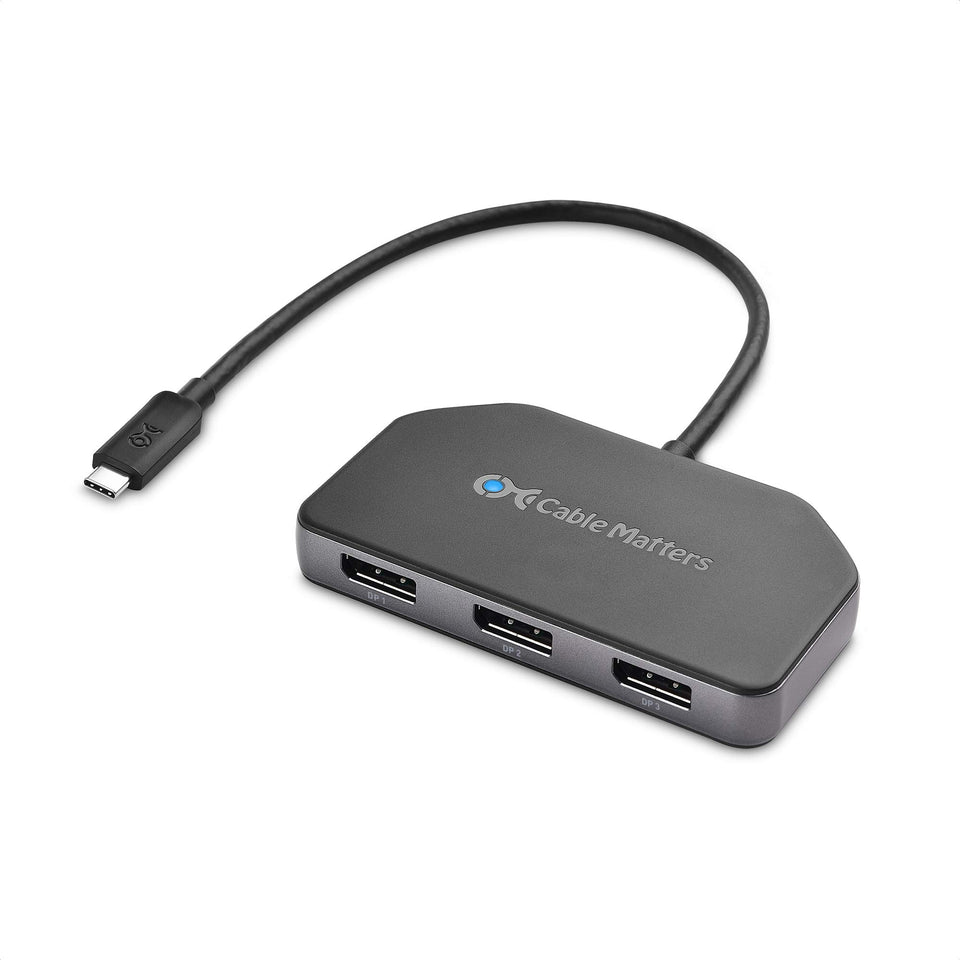 Cable Matters triple-monitor USB-C hub powering three displays in a desk setup.