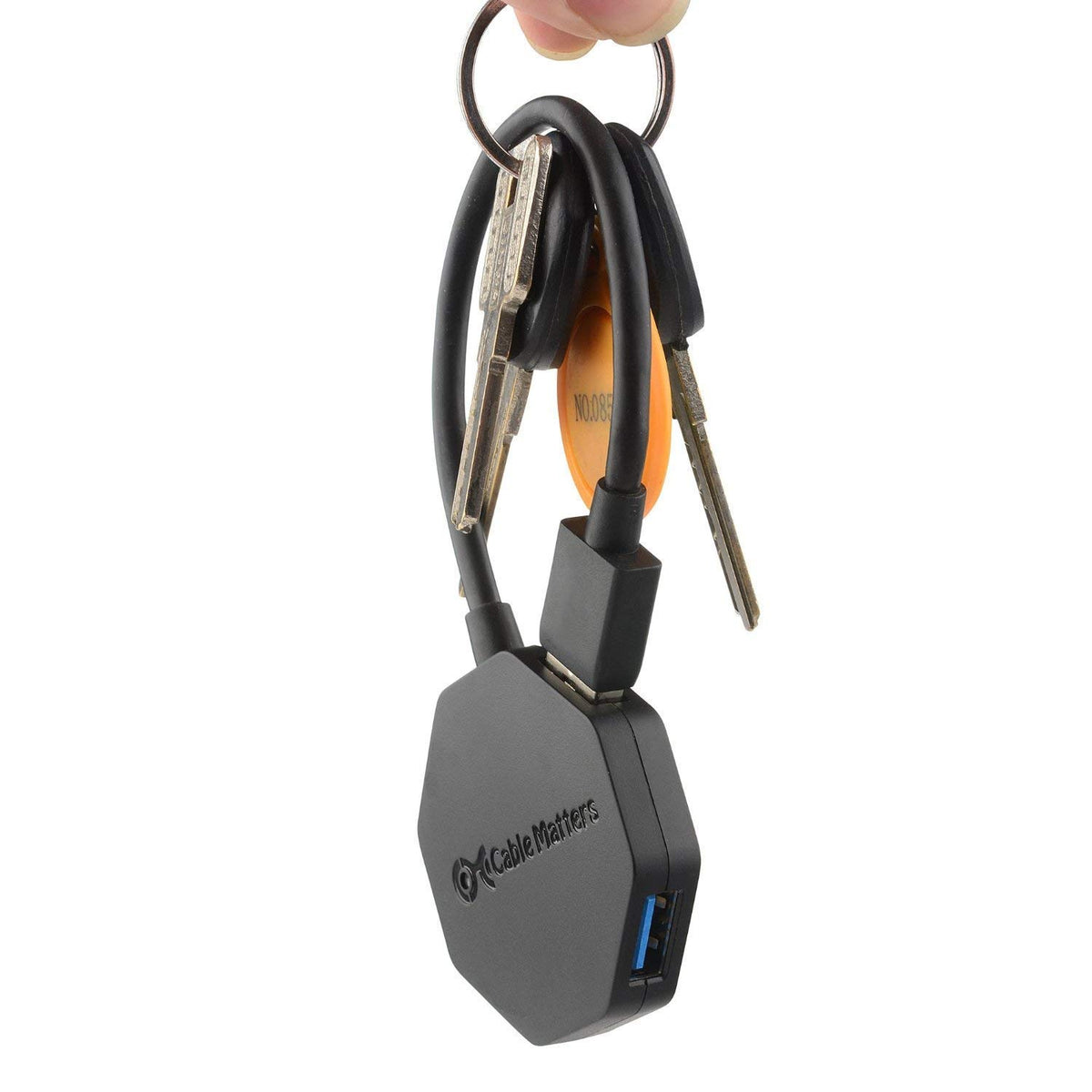 Cable Matters ultra mini inside a backpack pocket with accessories, emphasizes travel-ready convenience