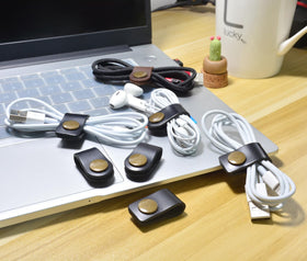 CAILLU leather earbud case with soft texture protects headphones in bag.
