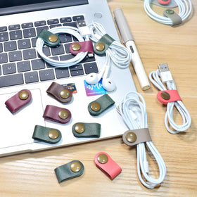 CAILLU Leather cable keeper, compact pocket-friendly design for on-the-go cable organization.