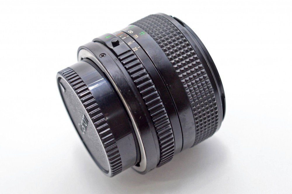 Compact build of the Canon 28mm f/2.8 FD lens in close-up