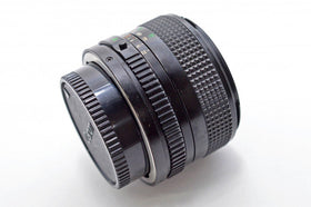 Compact build of the Canon 28mm f/2.8 FD lens in close-up
